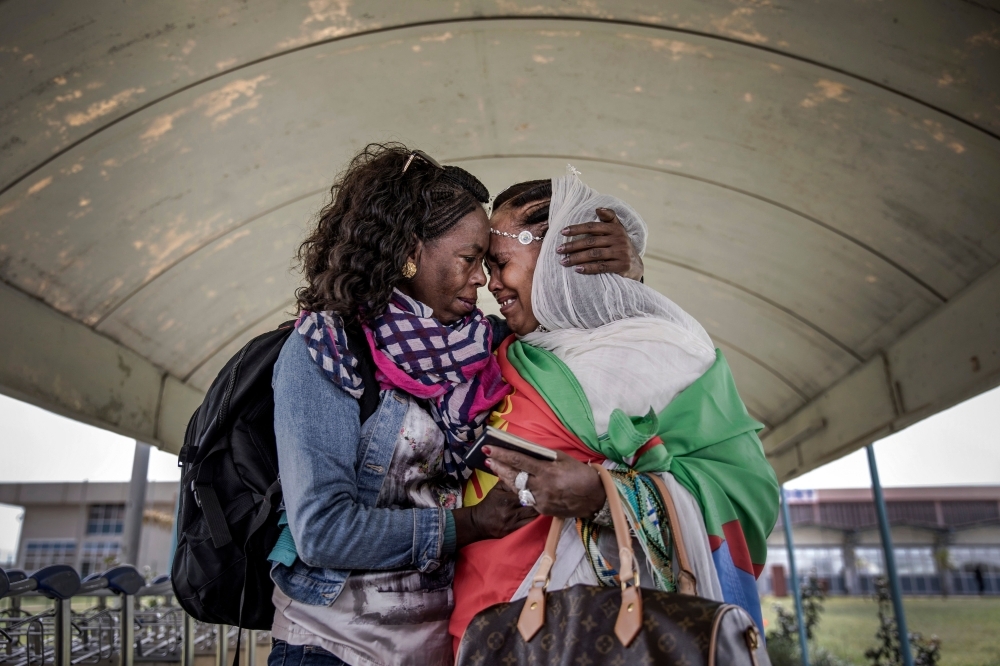 Azmera Addisalem, second left, and her family get emotional after meeting her father (who is an Ethiopian journalist) for the first time in twenty years, upon his arrival at the Asmara International airport in this July 18, 2018 file photo. — AFP