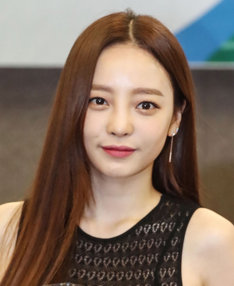 The portrait of late K-pop star Goo Hara is seen surrounded by flowers at a memorial altar at a hospital in Seoul on Monday. — AFP