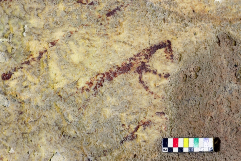 This handout photography releases by Griffith University on Wednesday shows cave art inside Bulu Sipong 4, Sulawesi, Indonesia. — AFP