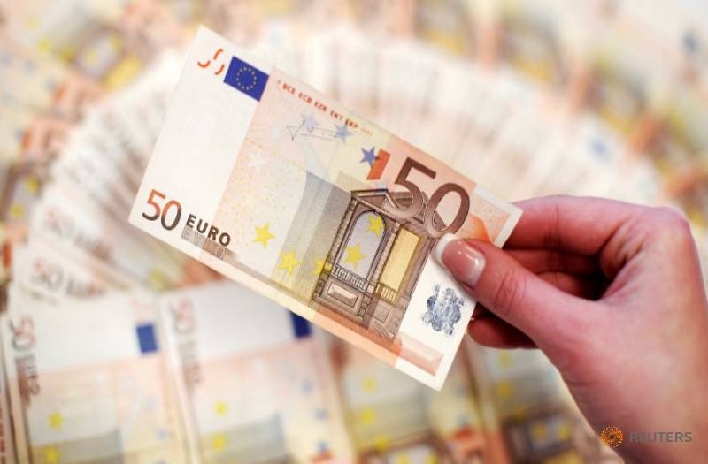 An employee shows fifty-euro notes in a bank in Sarajevo in this Mar 19, 2012 file picture. — Courtesy photo