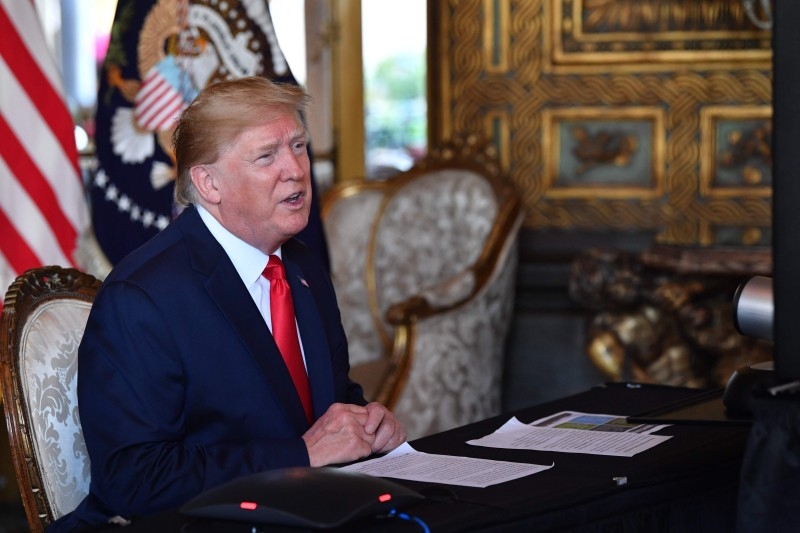 US President Donald Trump makes a video call to the troops stationed worldwide at the Mar-a-Lago estate in Palm Beach, Florida, in this Dec. 24, 2019 file photo. — AFP