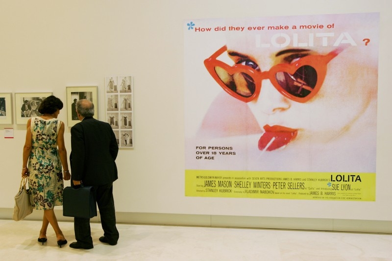 In this file photo taken on Oct. 4, 2007 visitors look over poster of the a poster of 