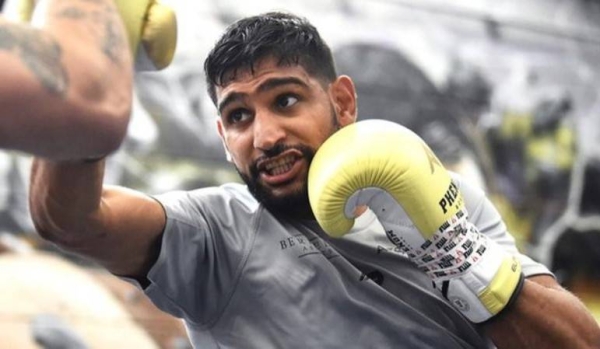 Amir Khan won a silver medal at the 2004 Olympics before a 40-fight professional career.