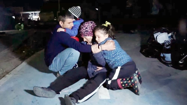 People react after a 6.4 magnitude earthquake hit in Antakya, southern Turkey, on Monday. — courtesy Reuters