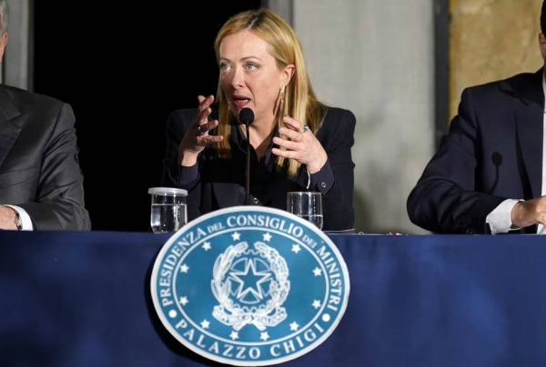 Italian Premier Giorgia Meloni presides over a Cabinet session in Cutro's town council hall, southern Italy, Thursday.