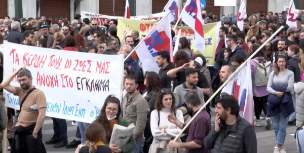 Protesters shout slogans during a rally following the Feb. 28 train collision in central Greece, in front of the parliament, in Athens, Sunday.