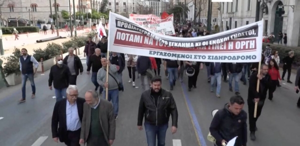 Protesters shout slogans during a rally following the Feb. 28 train collision in central Greece, in front of the parliament, in Athens, Sunday.