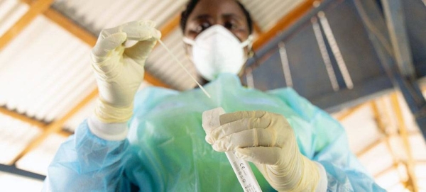 A health worker in Suriname prepares to administer a rapid COVID-19 test. — courtesy UNICEF/Timoty Henny/Slingshot