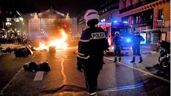Rubbish and bins were set alight across Paris during protests following Monday's vote