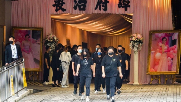 Mourners leave the memorial hall during the funeral of model Abby Choi in Hong Kong on June 18, 2023