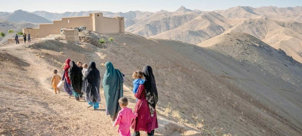 A group of women and their children walk Daikundi in remote central Afghanistan. — courtesy UNICEF/Mark Naftalin