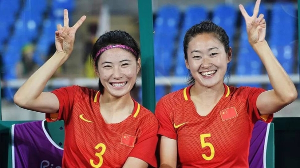 Xue Jiao, pictured on the left here, played for the Chinese women's national football team as a defender for years.
