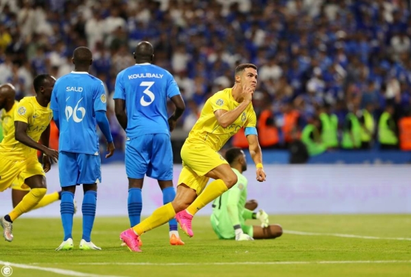 Cristiano Ronaldo scored two goals before exiting injured, leading his team Al-Nassr to a 2-1 victory over local rivals Al-Hilal with ten players, clinching the title of the King Salman Club Championship in Taif on Saturday.