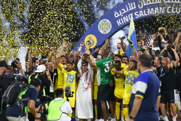 Cristiano Ronaldo scored two goals before exiting injured, leading his team Al-Nassr to a 2-1 victory over local rivals Al-Hilal with ten players, clinching the title of the King Salman Club Championship in Taif on Saturday.