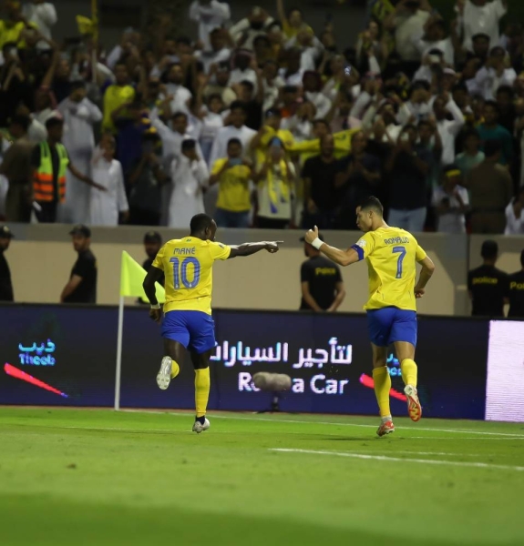 Ronaldo celebrates his goal with Sadio Mane.
