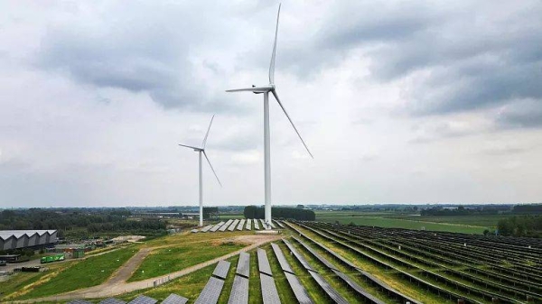 A solar panel park and wind turbines are seen in Geldermalsen, Netherlands