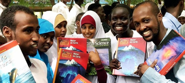 Abdullahi Mire (far right) is supporting education initiatives in Dadaab refugee complex in northeastern Kenya. — courtesy UNSOM