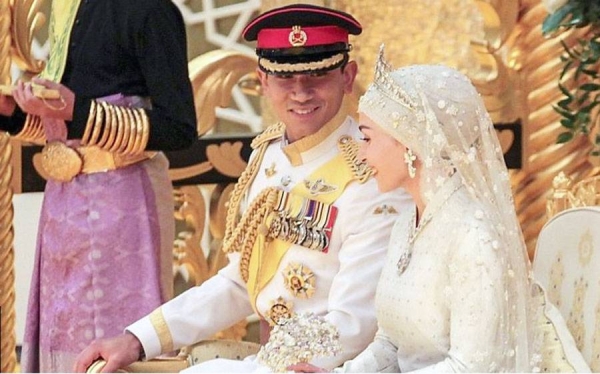 Brunei's national broadcaster RTB shows the royal couple as they come together at the end of their wedding
