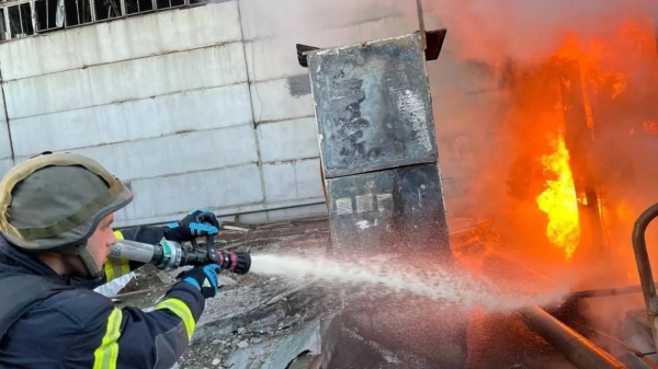 A firefighter tackles a blaze after a Russian attack on a power station at an undisclosed location in Ukraine on April 11, 2024