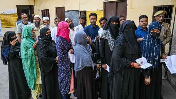 Voters queue at a polling station in Muzaffarnagar district, Uttar Pradesh, India, on Friday, April 19, 2024