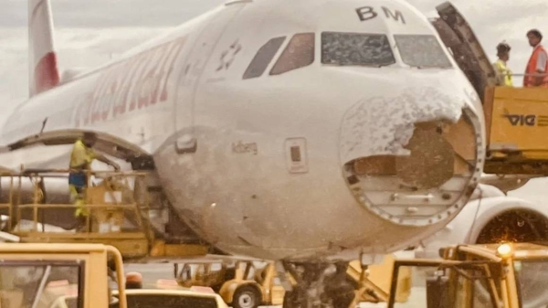 Despite extensive damage to the nose and cockpit, the plane landed safely with no injuries reported