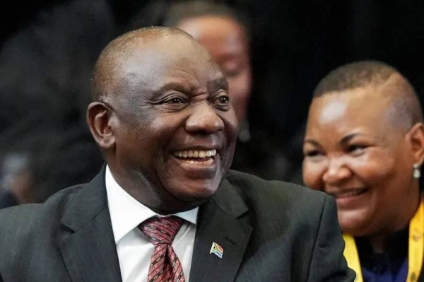 Cyril Ramaphosa reacts in parliament after being re-elected president