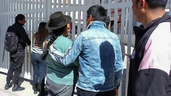 Relatives of the passengers wait for news about their loved ones outside the Mariscal Hospital in Ayacucho, Peru