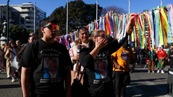 Members of the public arrive as part of a protest march prior to the release of The Royal Commission of Inquiry into Abuse in Care report at Parliament on July 24, 2024 in Wellington, New Zealand