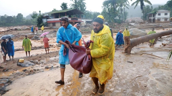 Rescuers carry the body of a victim at a landslide site in Wayanad, in the southern state of Kerala, India, on July 30, 2024