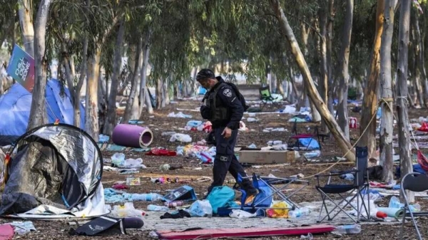 An Israeli officer at the site of the Supernova music festival after the killing of hundreds of Israeli civilians by Hamas-led gunmen