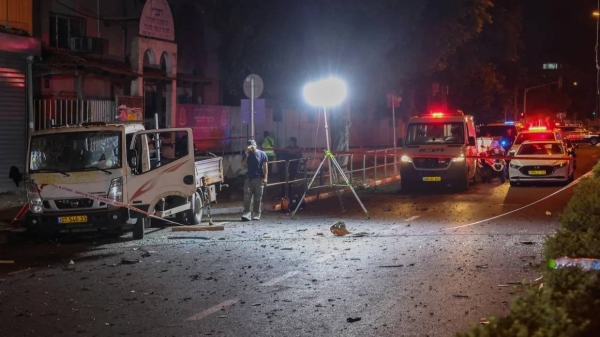 Israeli security and emergency personnel cordon off the site of an explosion in Tel Aviv on August 18, 2024