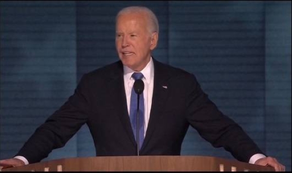 Joe Biden speaks to a packed arena in Chicago on the first night of the Democratic National Convention.