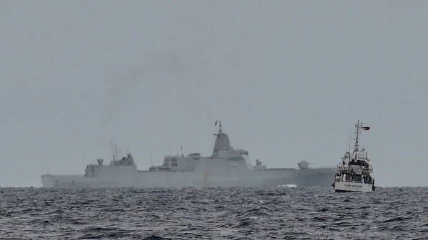 A vessel identified by the Philippine Coast Guard as a Chinese naval ship operates in the South China Sea on August 26