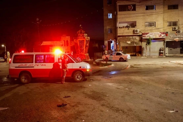 An ambulance is seen at the site of Israeli strikes where Palestinians were killed, in Tubas in the occupied West Bank, on September 11, 2024