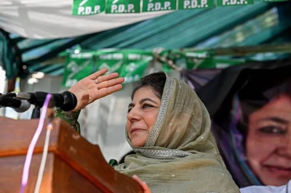 Mehbooba Mufti, former chief minister and PDP leader, greets her supporters at a rally