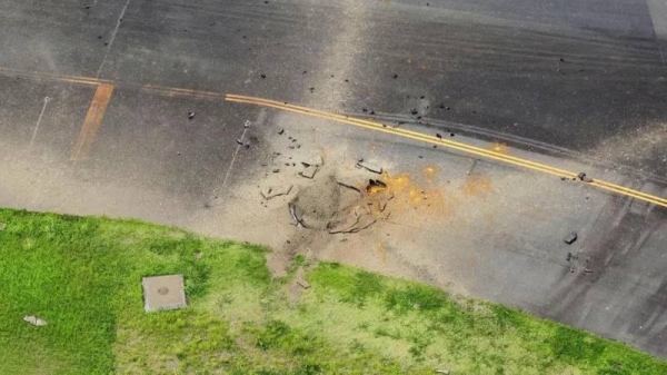 The blast left a crater near a runway at the airport