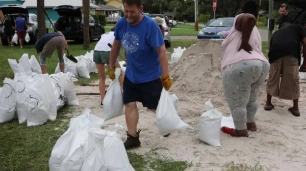 People fill sandbags as the state prepares for the arrival of Hurricane Milton in St Petersburg, Florida