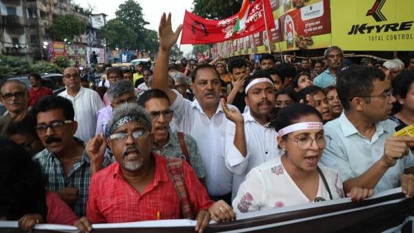 Doctors and citizens shout slogans during a protest march while junior doctors hold a hunger strike to protest against the rape and murder of a doctor trainee at RG Kar Medical College & Hospital in Kolkata, India, on October 8