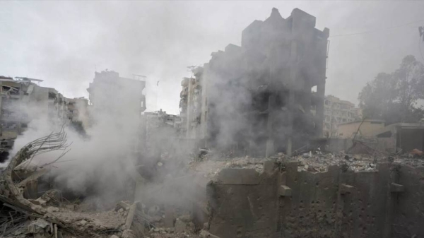 Smoke rises from destroyed buildings at the site of an Israeli airstrike hit in Choueifat, southeast of Beirut, Lebanon, Monday, Oct. 7, 2024