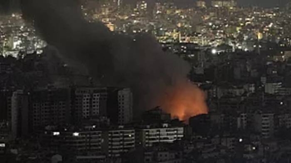 Flames and smoke rise from an Israeli airstrike on Dahiyeh, in the southern suburbs of Beirut.