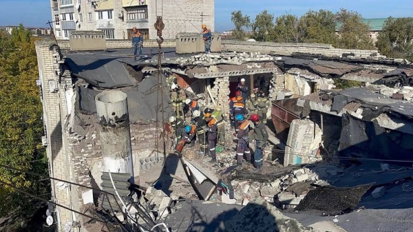 Russian Emergency Ministry rescuers work at the side the rocked by a gas blast a five-storey apartment building in Cherkessk, 31 October, 2024