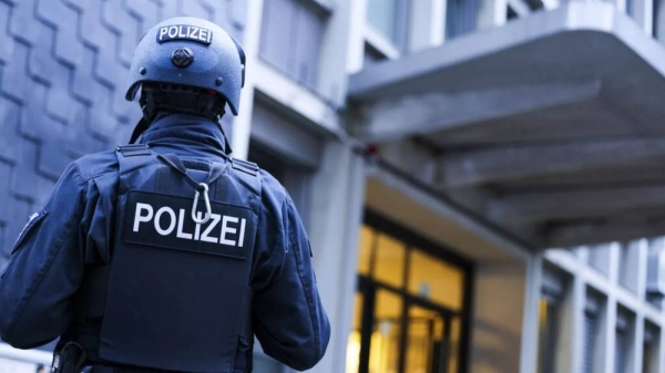 A German police officer stands guard in Solingen, Germany, Aug 24, 2024