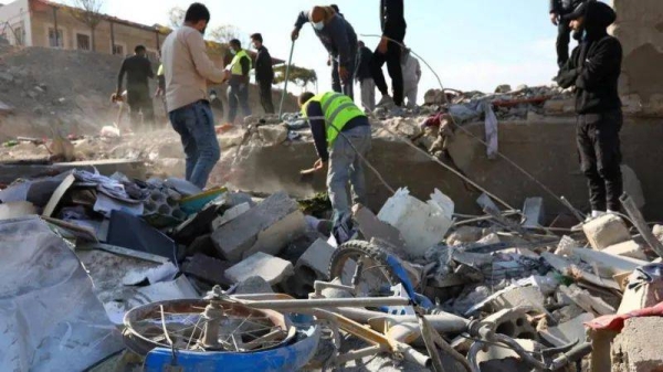 People search through rubble following a strike in the town of Al-Ain in the Baalbek region on Wednesday