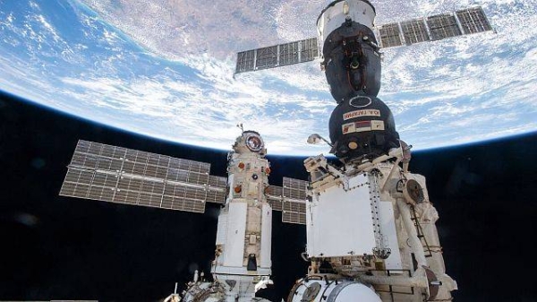 Russia's Nauka module is seen docked to the Zvezda module's Earth-facing port on the International Space Station on July 29, 2021. The Soyuz MS-18 crew ship (center) is docked to the Rassvet module