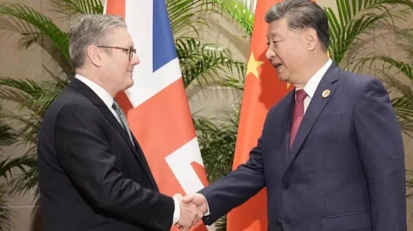 British Prime Minister Keir Starmer shakes hands with Chinese President Xi Jinping ahead of their bilateral meeting