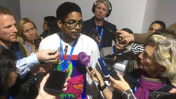 Michai Robertson speaks to the press at COP29, Baku