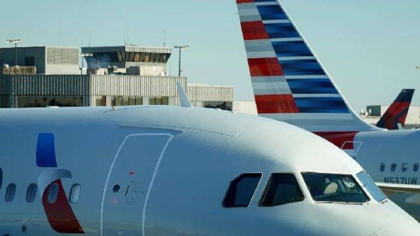 An American Airlines plane sits by a gate last month in Atlanta