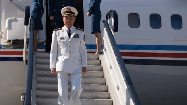 Miao Hua, director of the Political Work Department of China's Central Military Commission, disembarks his aircraft after arriving at Pyongyang International Airport on October 14, 2019