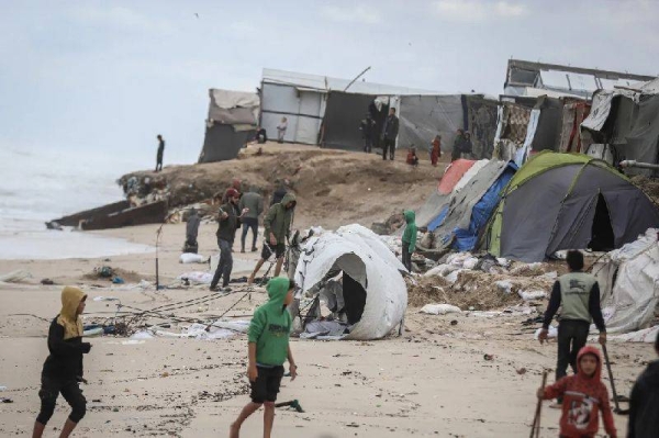 Damaged temporary shelters for displaced Palestinians are seen after bad weather on a beach near Deir al-Balah, central Gaza, on Monday, November 25, 2024