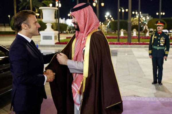 Saudi Crown Prince and Prime Minister Mohammed bin Salman receiving French President Emmanuel Macron at Al-Yamamah Palace in Riyadh on Monday.